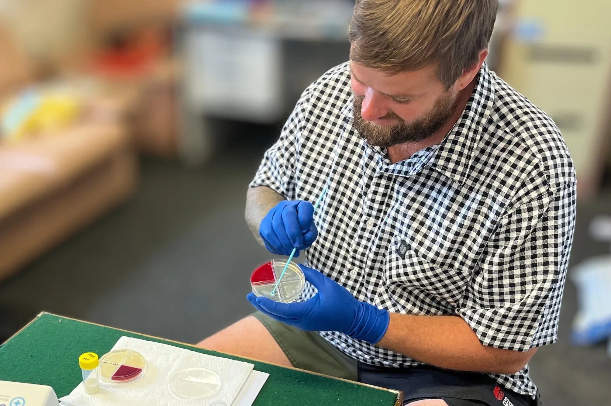 Dairy farmer logan dawson performing mastitis test with fcdc on farm